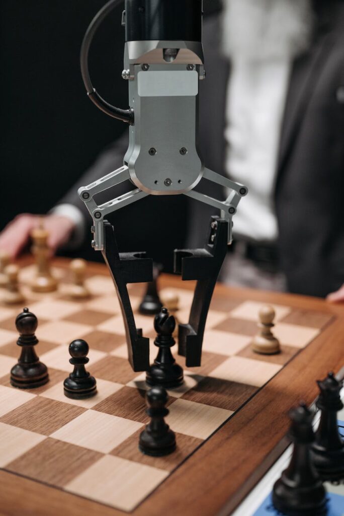 robot playing chess with a man